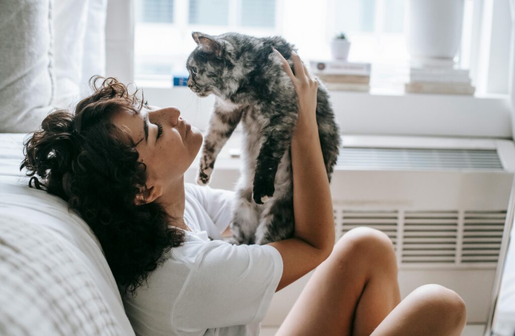 Cat Sitter Talking to Owner.